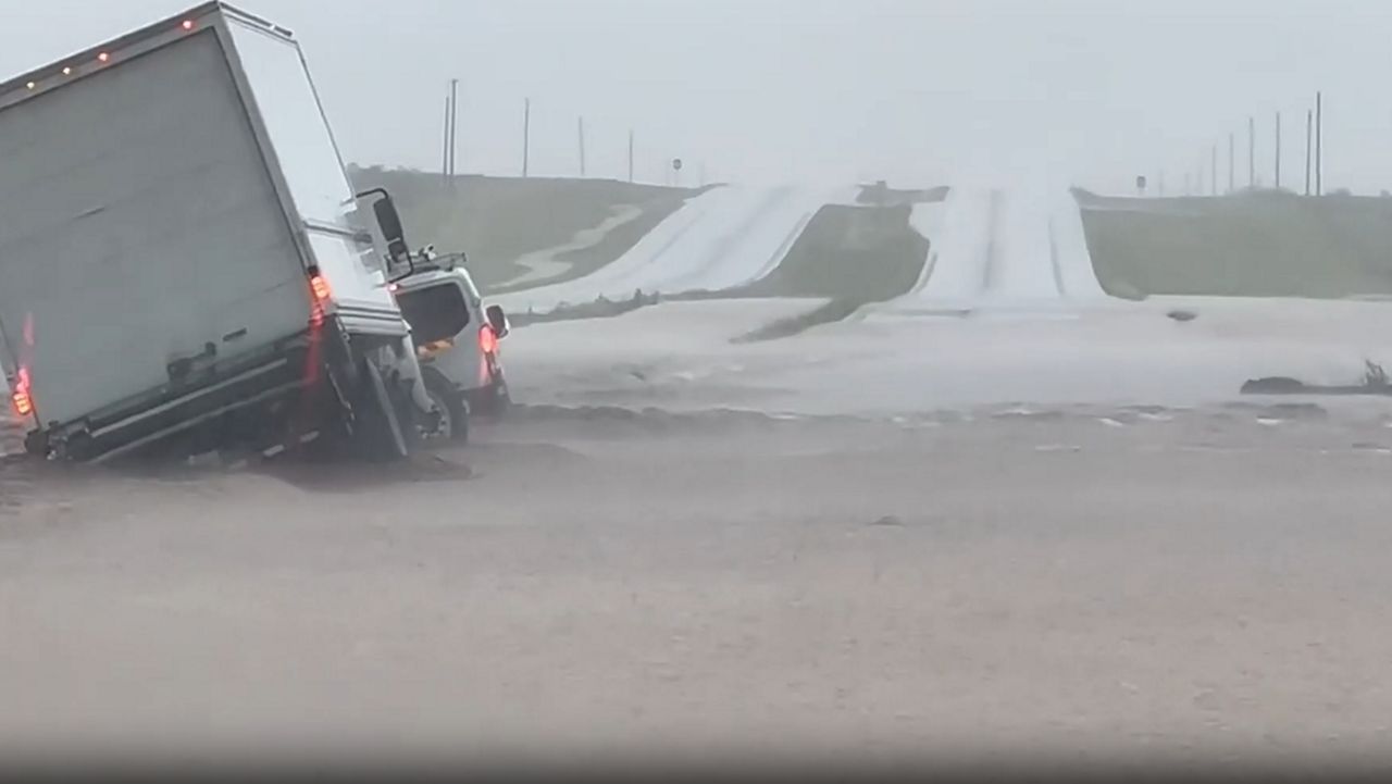 Watch: Flash flooding makes highway impassable in West Texas